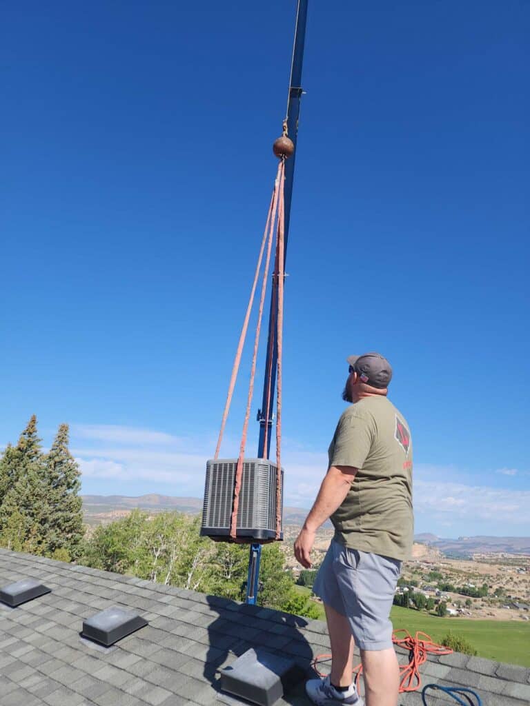 Technician working on outdoor utility pole installation