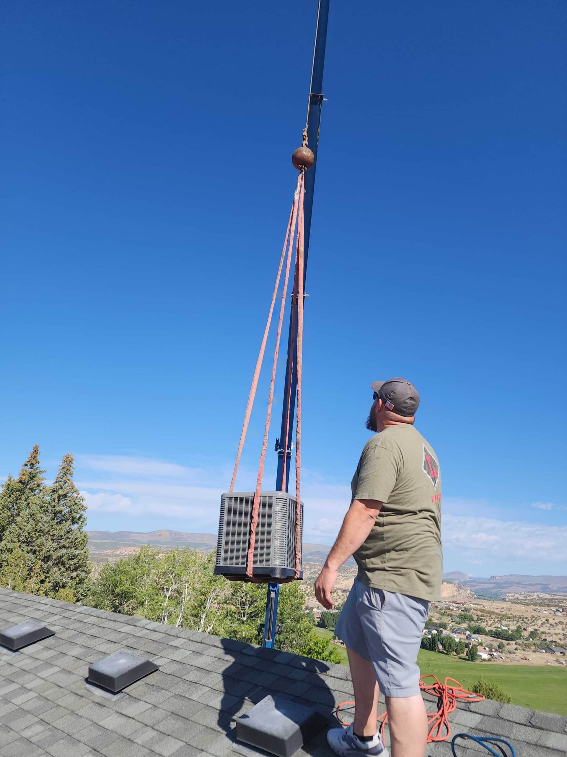 Technician working on outdoor utility pole installation