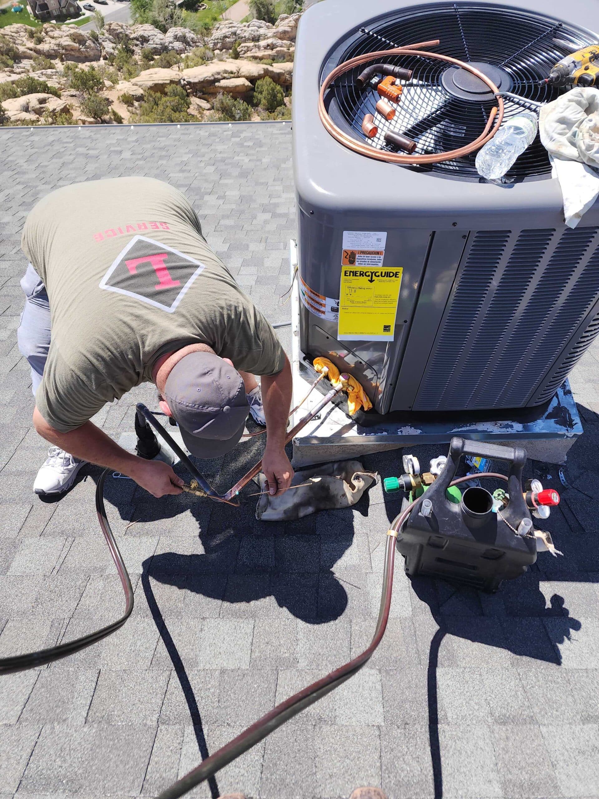 Technician servicing HVAC equipment during maintenance