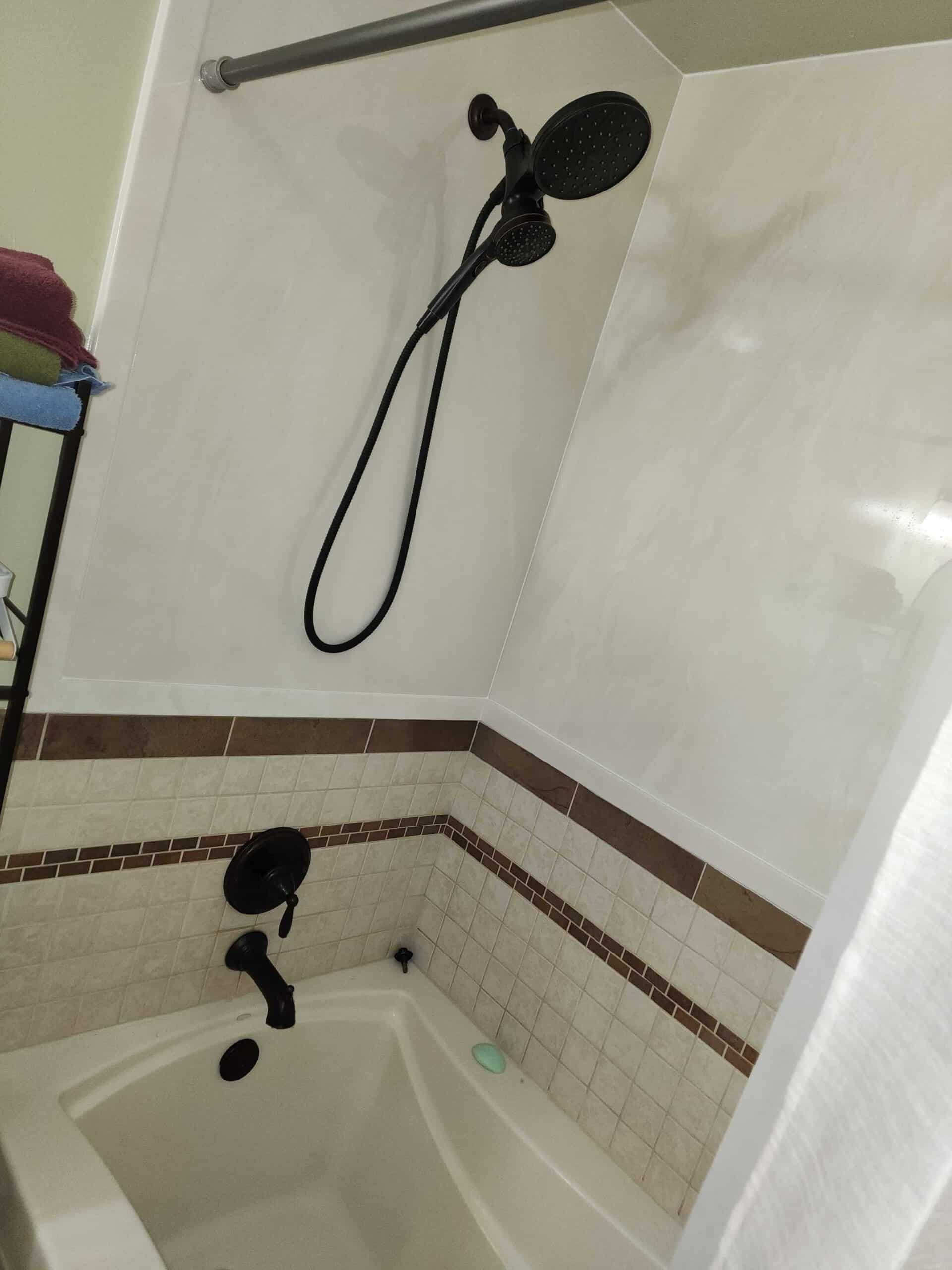 Modern walk-in shower with handheld shower fixture
