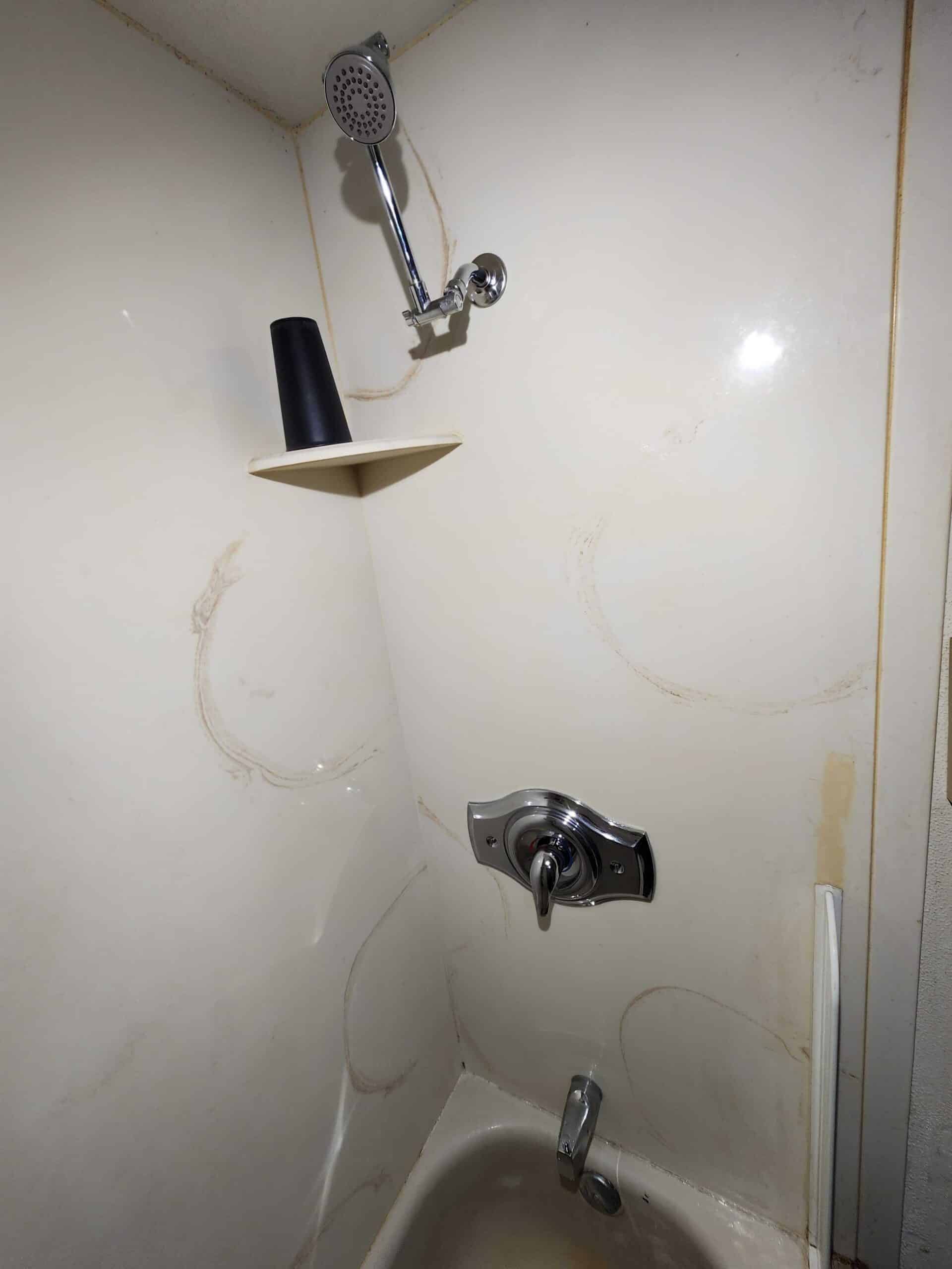 Shower wall with newly installed shower valve and trim
