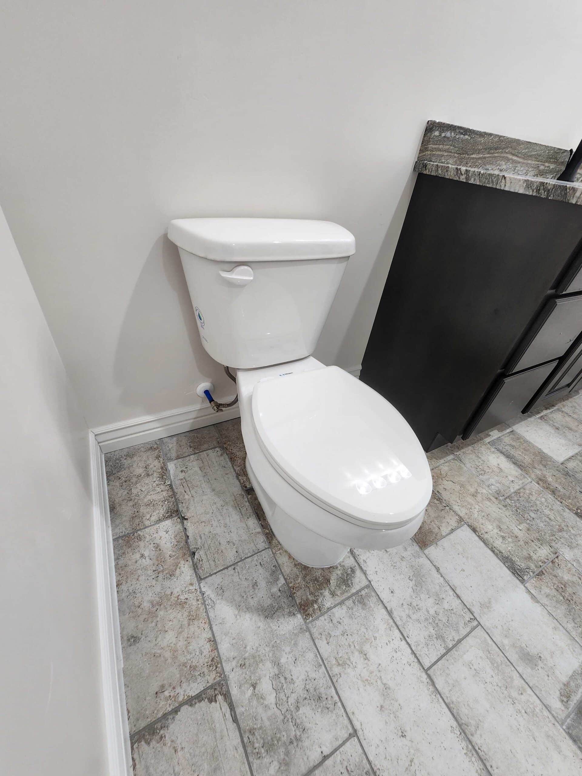 Newly installed toilet in finished bathroom